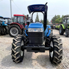 Trator New Holland SMH754 Usado 4WD com guarda-sol e equipamento agrícola